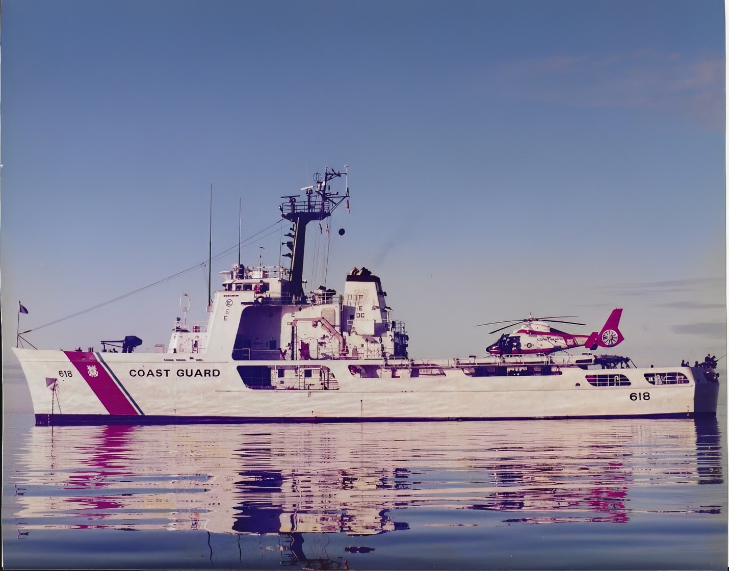 One of the first color photographs of USCGC ACTIVE at anchor with an MH-65 helicopter
